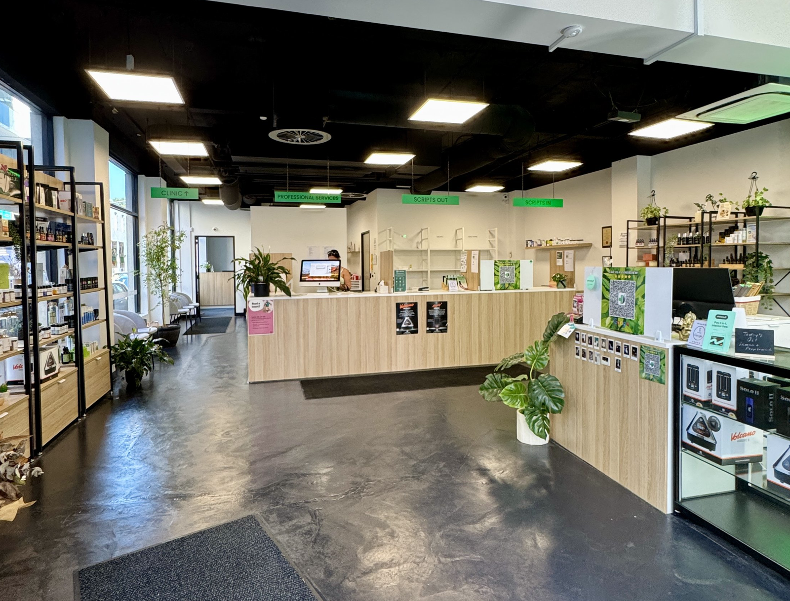 Inside trueleaf on Chapel Street: the dispensary counter, timber shelves and the corridor to the clinic